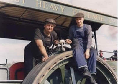 Men Sitting on a Steam Engine